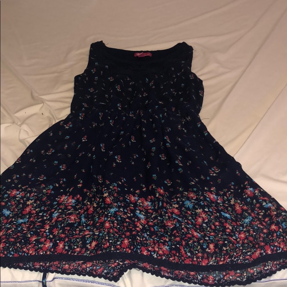 Navy blue dress, lace embroidery, and flowers